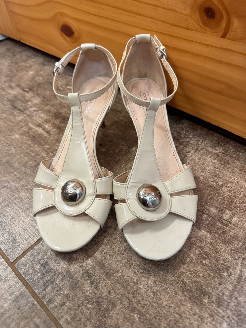 Coach Cream T-Strap Kitten Heeled Sandals with Silver Medallion